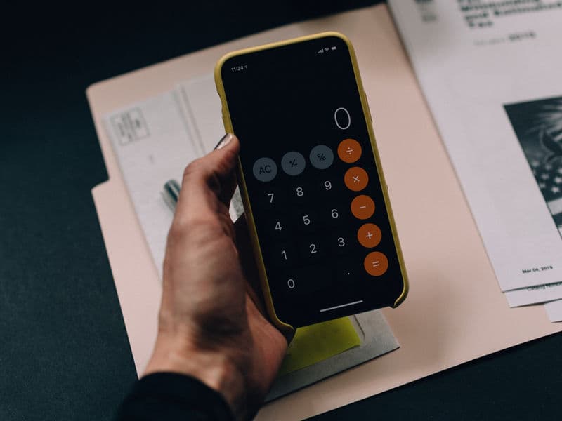 Consumer calculating her real costs.