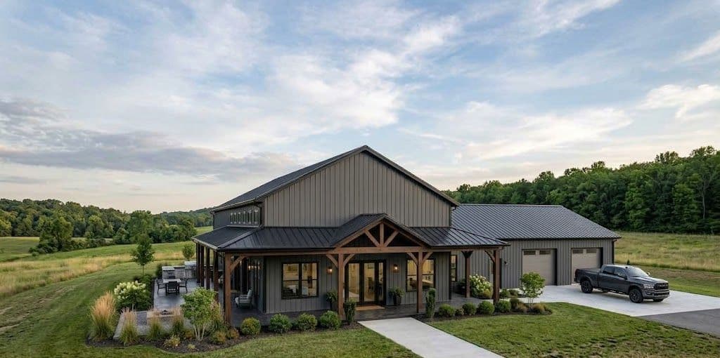 A steel barndominium shell with a large attached garage.